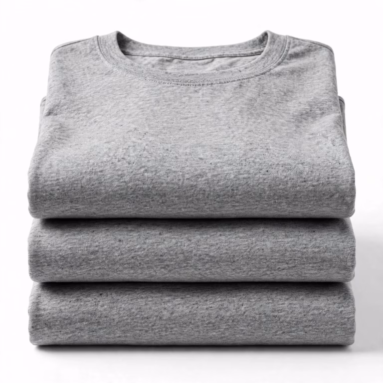 Folded stack of heather grey blank t-shirts showing melange fabric